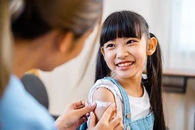 Happy girl during a routine immunization visit