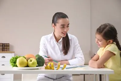 Pediatrician guiding a child through weight and nutrition management