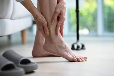 Adult woman with ankle instability, showing difficulty in maintaining balance.
