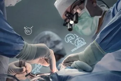 Surgeon performing transplant to a patient