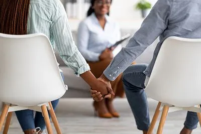 Husband and wife participating in couples therapy for relationship improvement