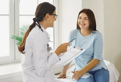 Young woman talking to a doctor