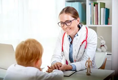 Young boy is talking to a doctor on clinic