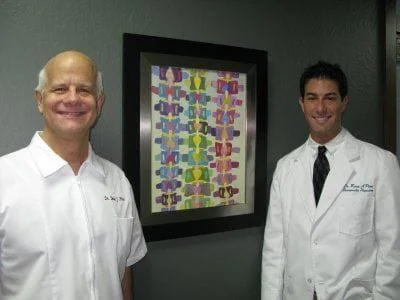 doctors infront of artwork