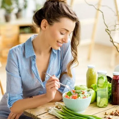 Woman eating salad