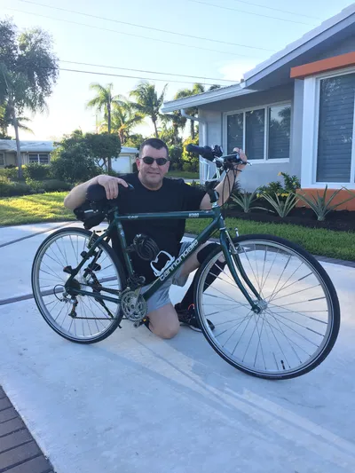 Greg Perez with green bike