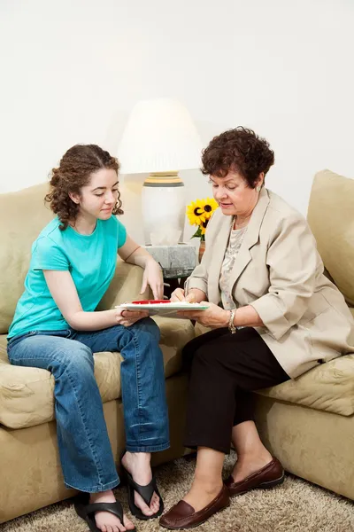 older woman speaking with a younger woman