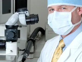 eye surgeon getting ready to preform lasik surgery