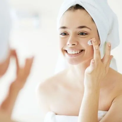 woman smiling in mirror