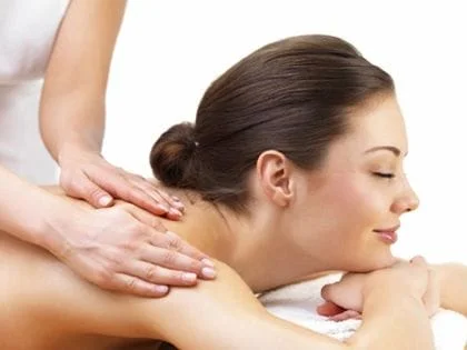 Woman being massaged in a stock photo
