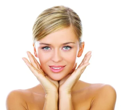 blond woman with hands by her face, after Botox Salem, OR dentist