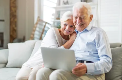 elderly couple on computer