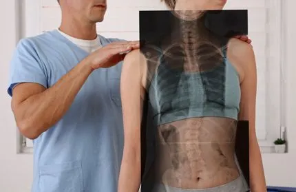 Doctor examining spine