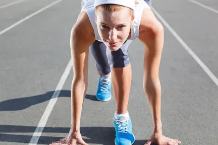 A woman reardy to run