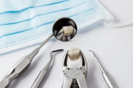 assortment of dental tools on white counter, general dentistry Cary, NC dentist