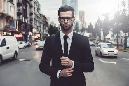 Sharp dressed man wearing prescription glasses
