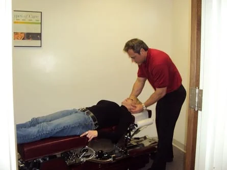 Dr. Rupert adjusting patient