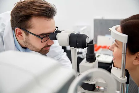 optometrist examining a patients eyes in Stratford and Bridgeport