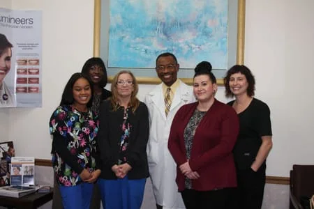 Dr. Vincent Oganwu DDS and his dental staff posing for photo in office, Olympia Fields Dentist