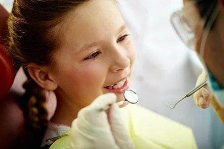 Girl getting a dental exam