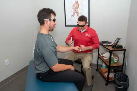 Doctor using laser treatment