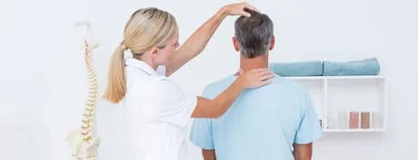 Chiropractor in kenosha does an adjustment on patient with headache treatment in Kenosha