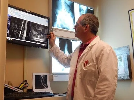 Dr. Greg reviewing MRI and X-Rays