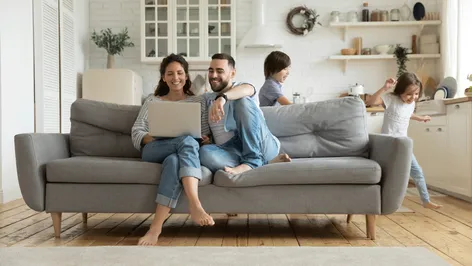 Family on couch with computer