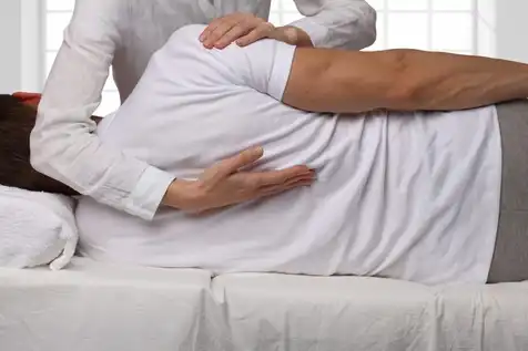 Doctor gives patient a spinal adjustment after an auto accident