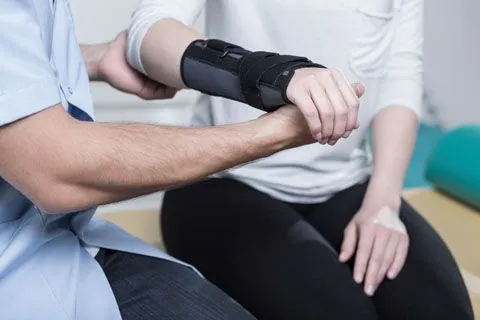 Doctor working on wrist therapy