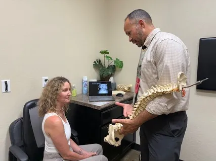 Dr. Yamamoto showing spinal model