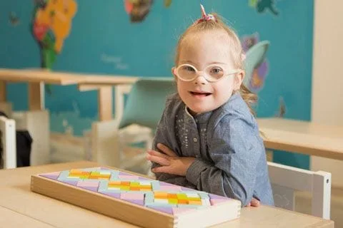 Young special needs girl with glasses