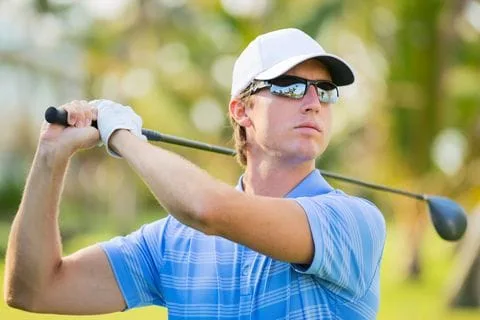 Male with glasses while golfing