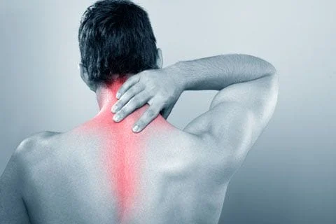 Back of a male showing red on spine for pain spots