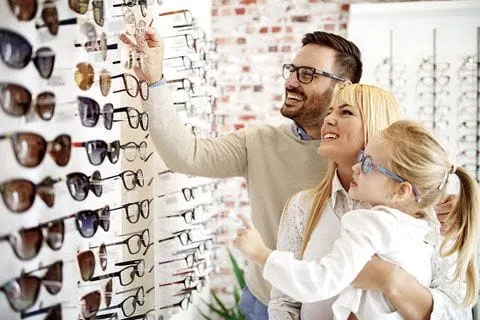 Family looking at eye glass options