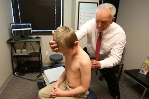 Pediatric Chiropractor Treating a Child