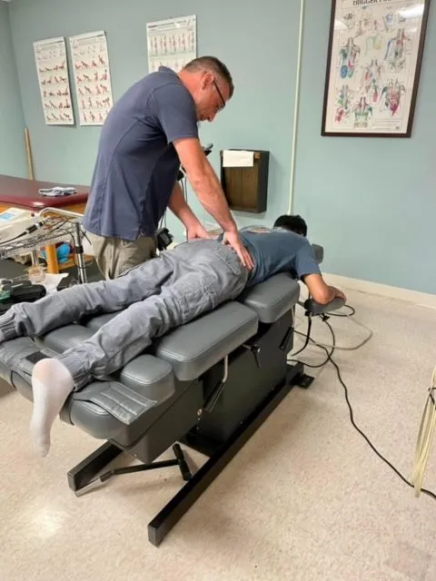 spinal adjustment on a patient