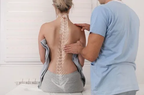 Doctor examining spine