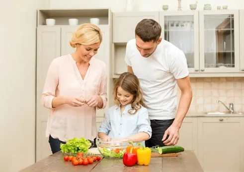 family of three with some vegetables