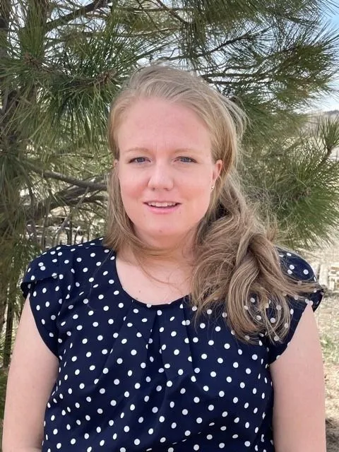 Female in Blouse smiling