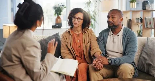 Therapist guiding couple during counseling session