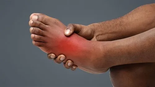 Person with foot pain in red highlights