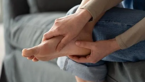 Person suffering from foot pain