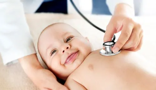 Newborn baby undergoing a routine checkup with a pediatrician