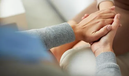 supportive hand holding