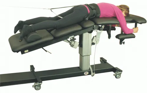 Woman using a spinal decompression machine.