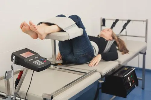 Women on spinal decompression machine