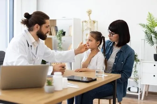 Parent accompanying their child during a same-day sick visit at the clinic