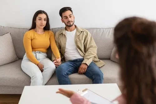Couple receiving relationship counseling from a therapist