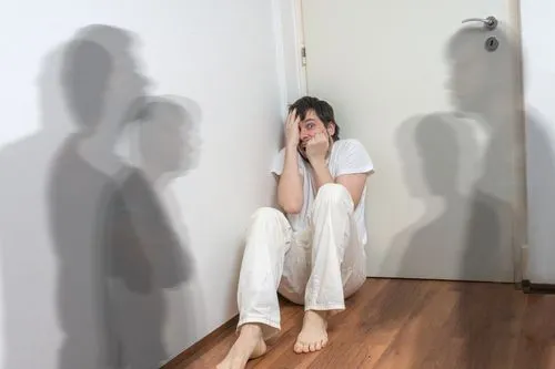 Man experiencing hallucinations and hearing things due to schizophrenia or psychosis